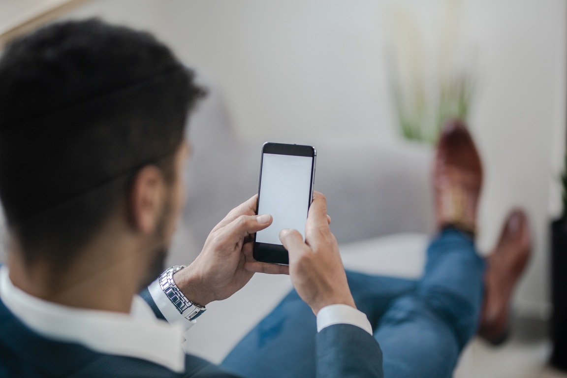 Businessmen is looking at phone